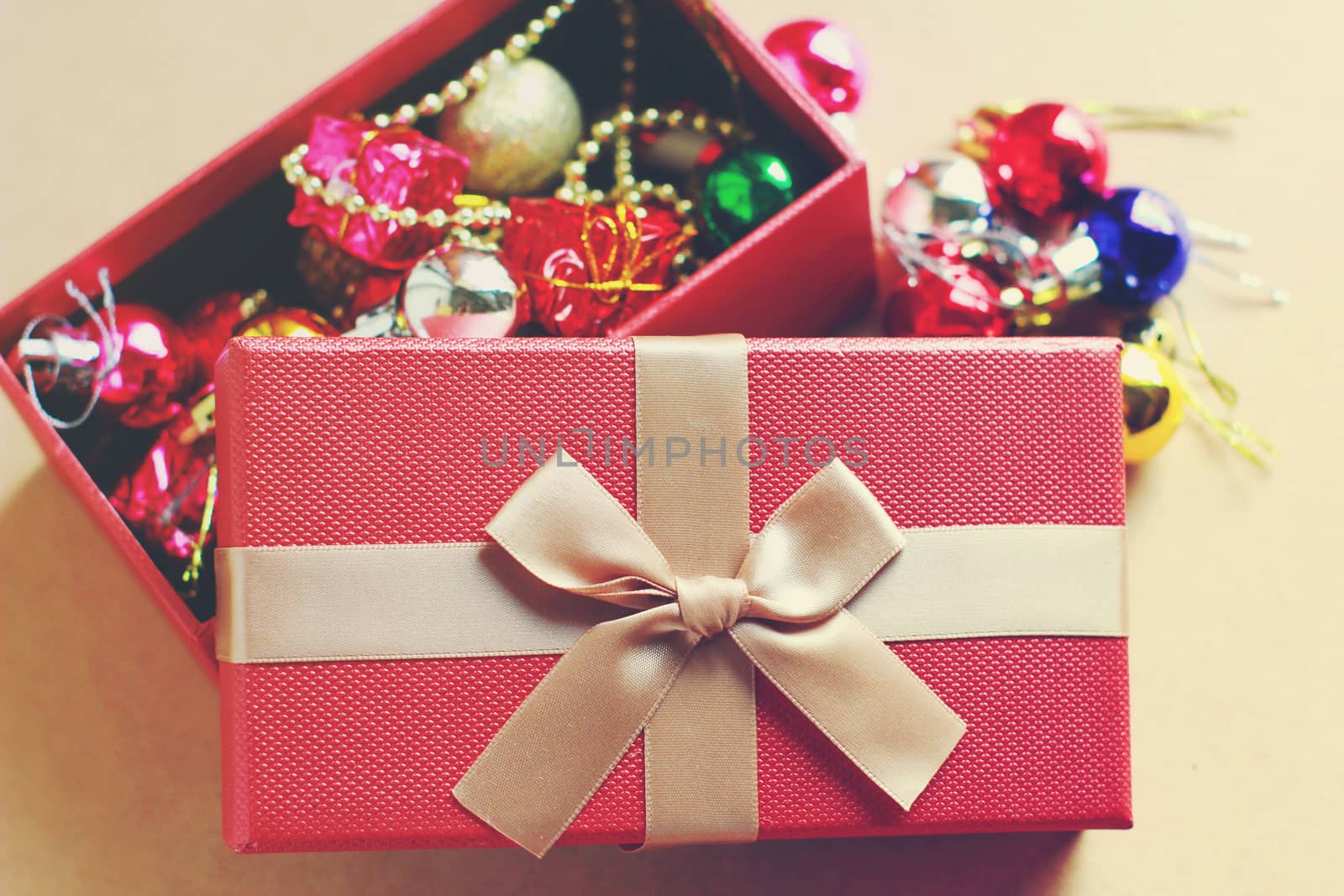 Gift red box contain with christmas ornament, retro filter effect