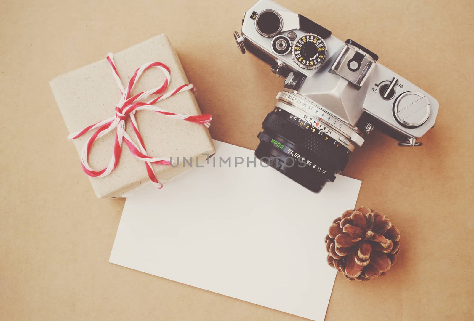 Handmade gift box and film camera on blank card with retro filte by nuchylee