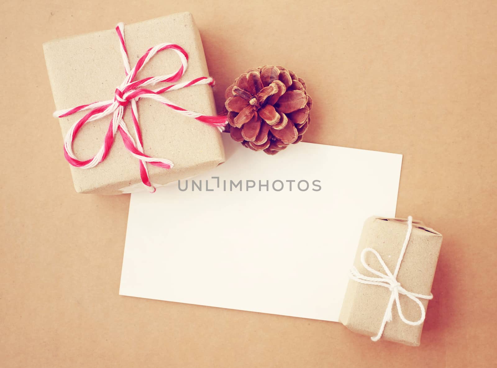 Handmade gift box and blank note paper with pine cone, retro filter effect