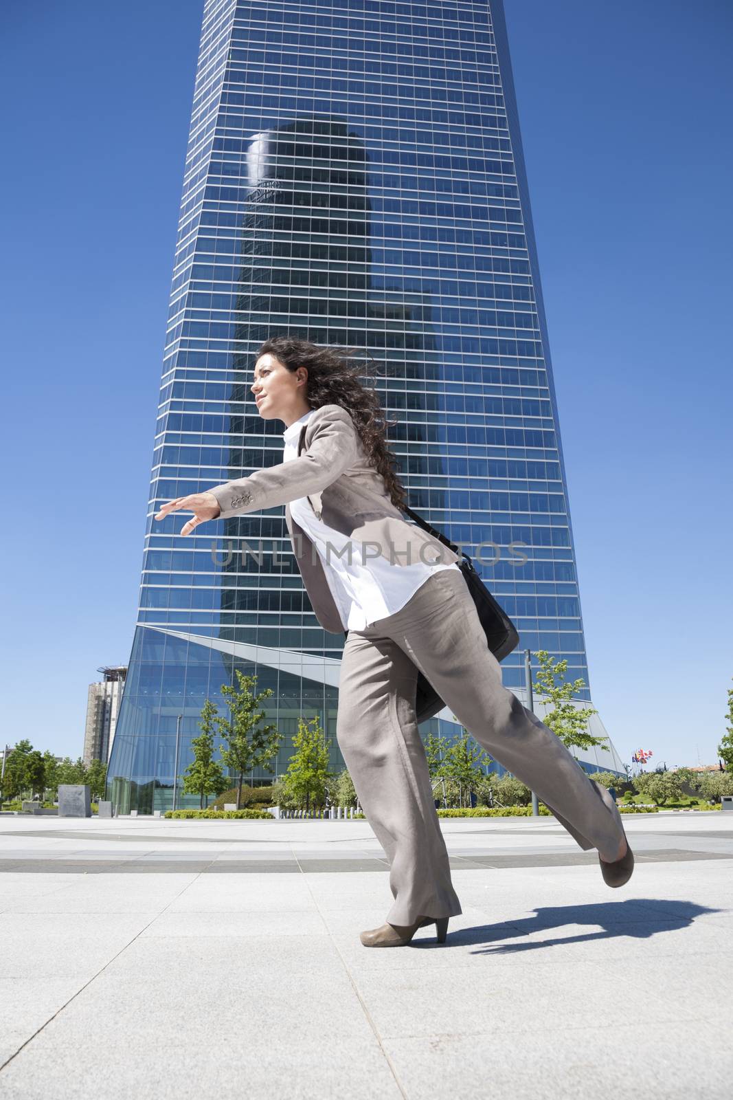 businesswoman running on skyscrapers background Madrid city