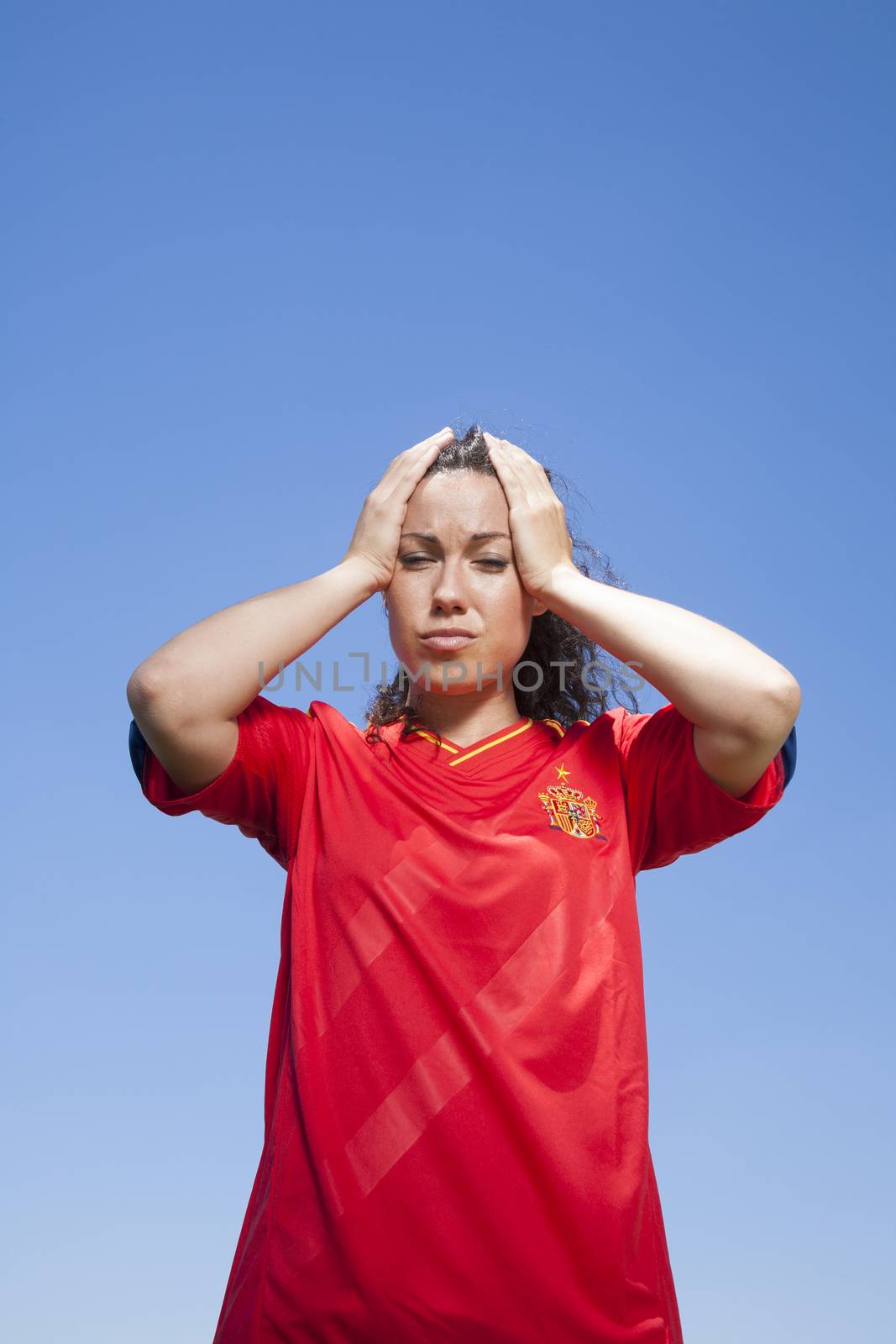 woman with red spanish soccer team shirt loser face