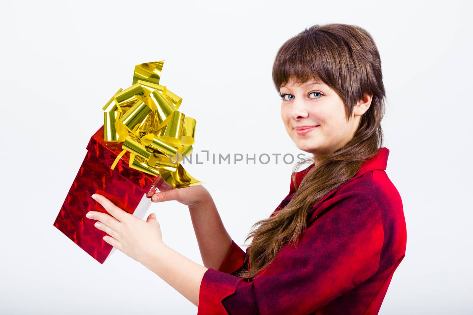 Young beautiful girl with a gift box