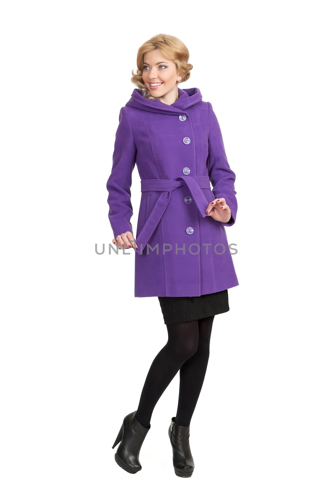 The girl in a violet autumn coat on a white background