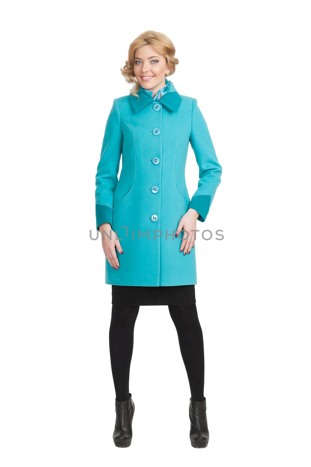 The girl in a turquoise autumn coat on a white background