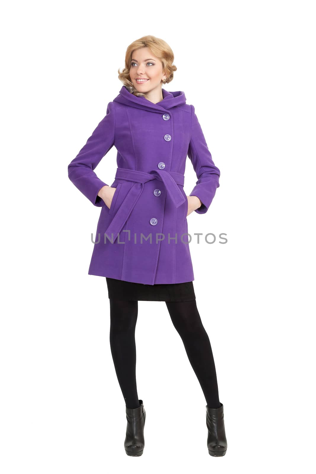 The girl in a violet autumn coat on a white background