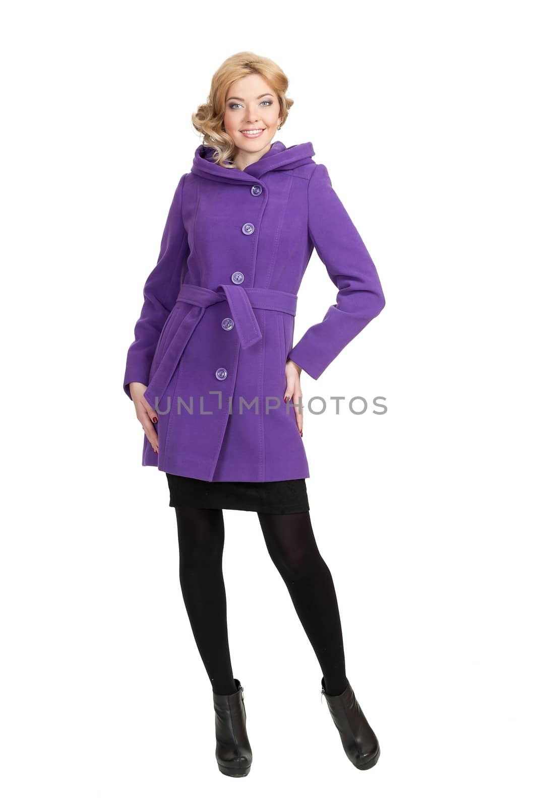 The girl in a violet autumn coat on a white background