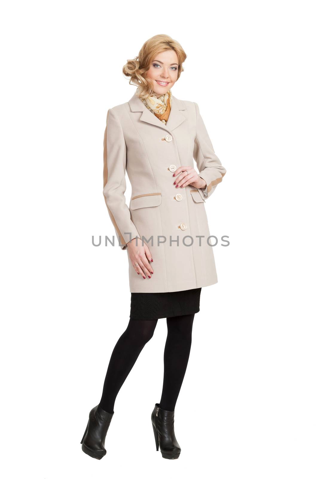 The girl in a white autumn coat on a white background