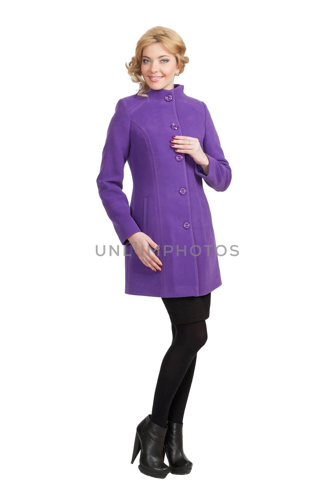 The girl in a violet autumn coat on a white background