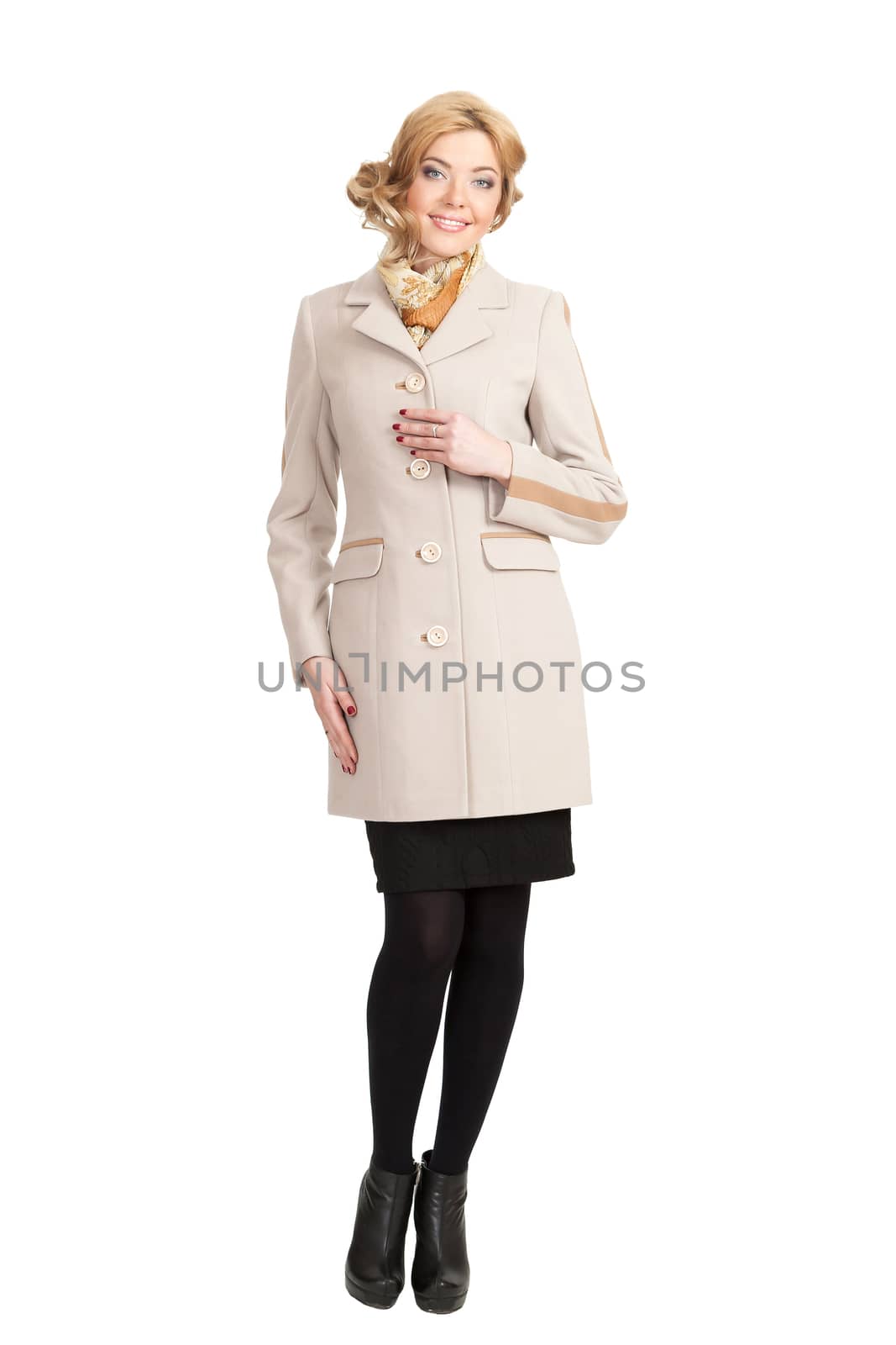 The girl in a white autumn coat on a white background