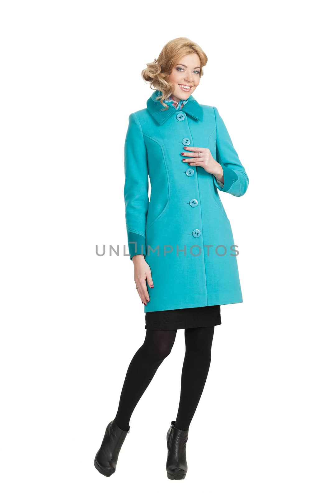 The girl in a turquoise autumn coat on a white background