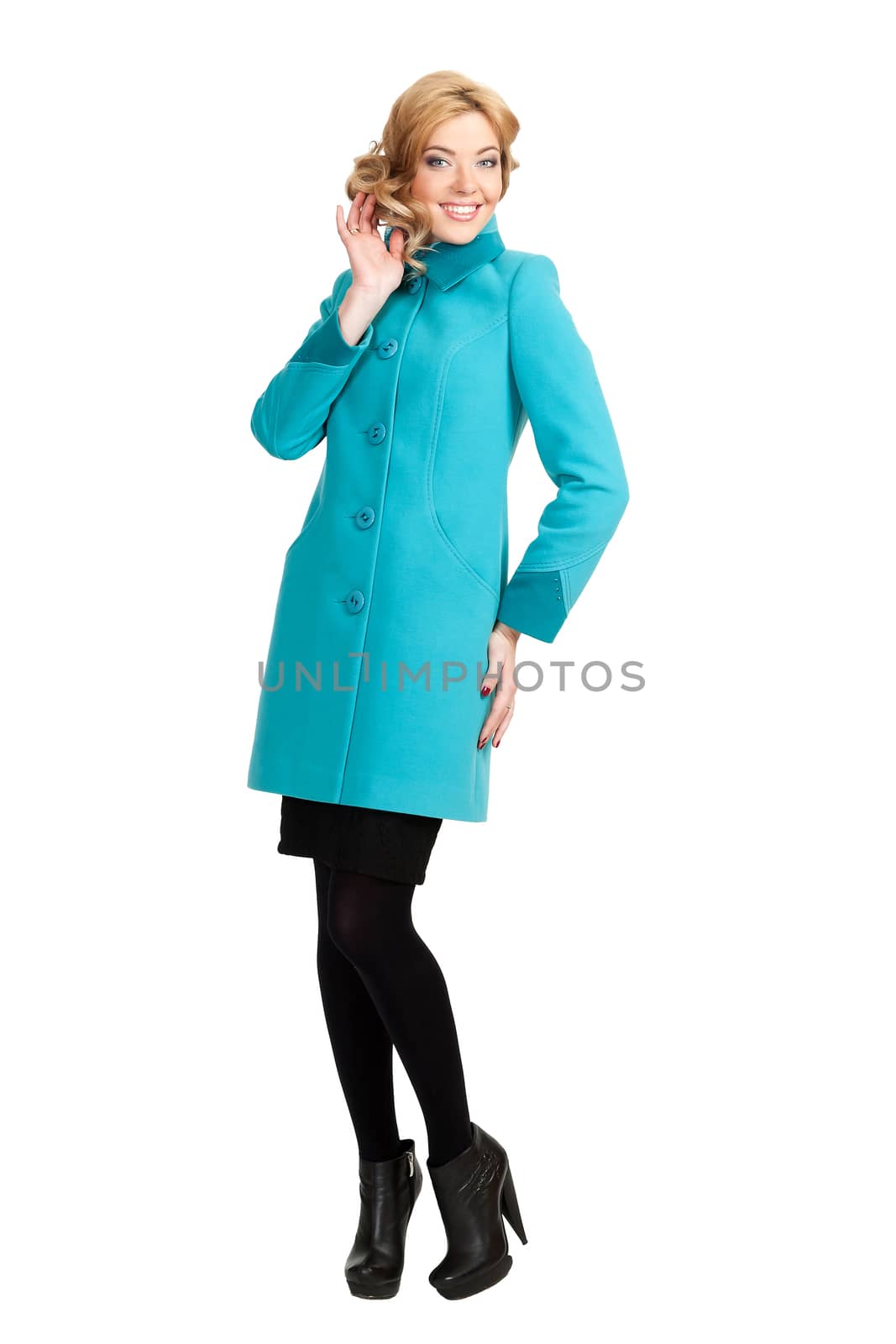 The girl in a turquoise autumn coat on a white background