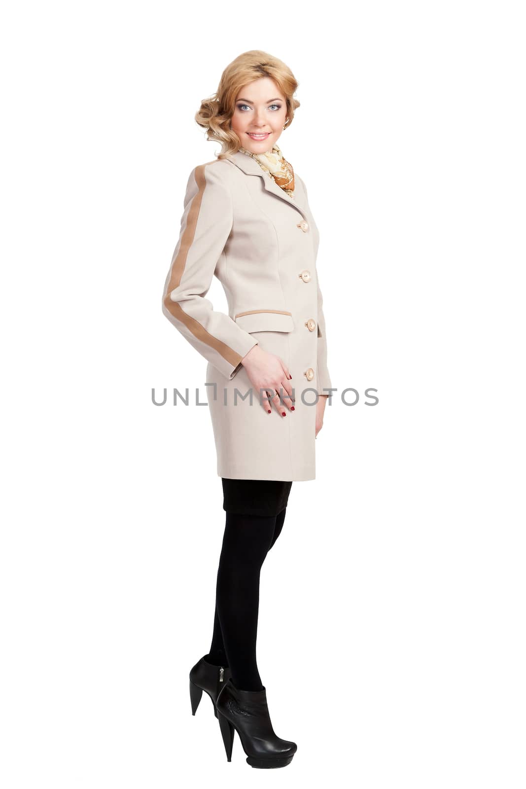 The girl in a white autumn coat on a white background