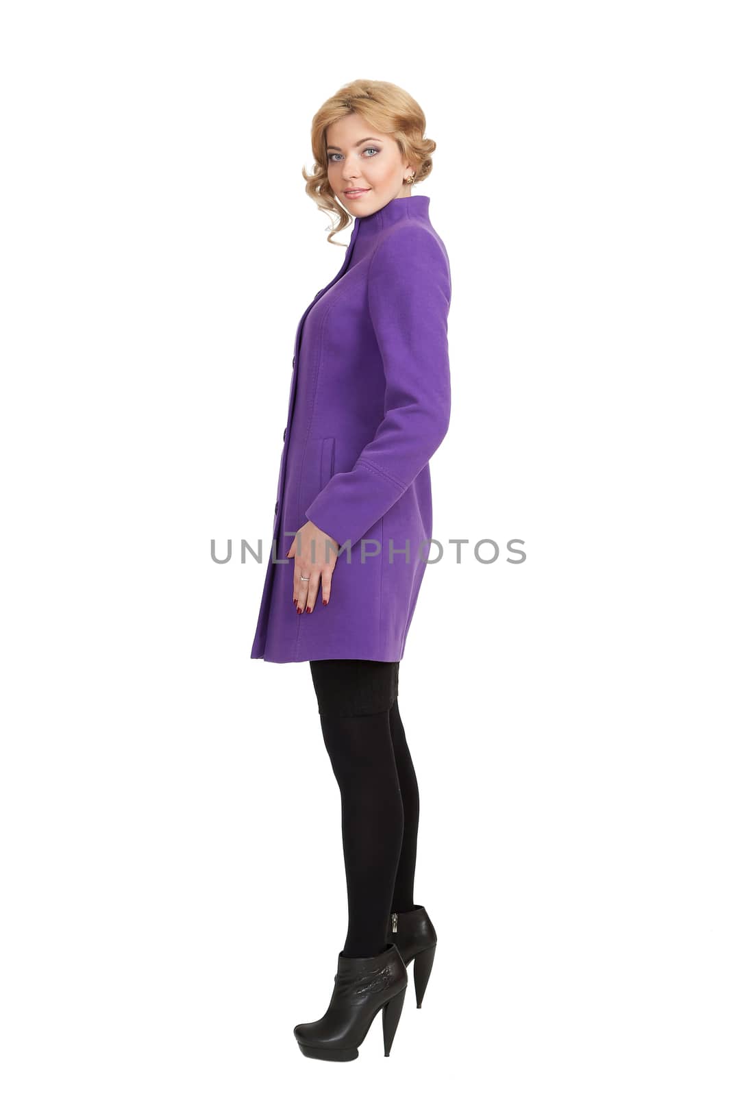 The girl in a violet autumn coat on a white background