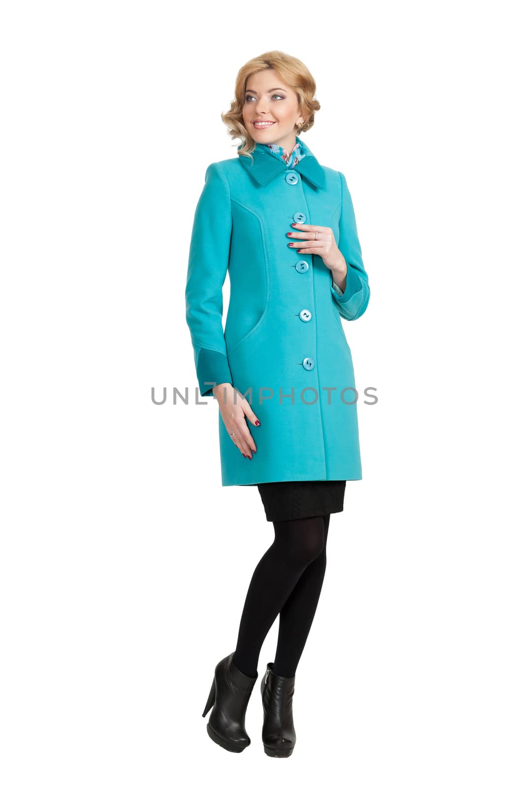 The girl in a turquoise autumn coat on a white background