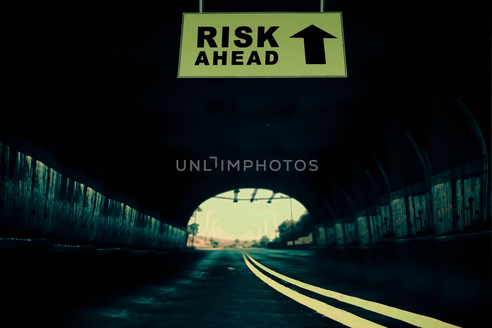A Notice Board On A National Highway tunnel  Showing Risk ahead Concept
