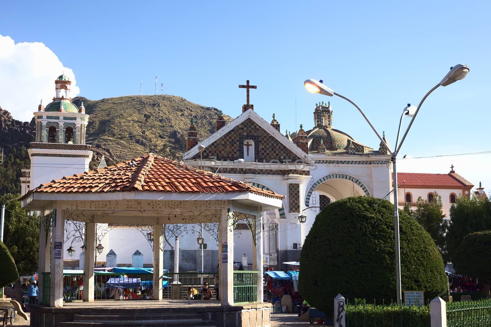 COPACABANA, BOLIVIA - OCTOBER 19, 2014: Pavillon on the Plaza 2 de Febrero (main square) wih the Basilica of Our Lady of Copacabana behind in the small tourist town along Lake Titicaca on October 19, 2014 in Copacabana, Bolivia. 