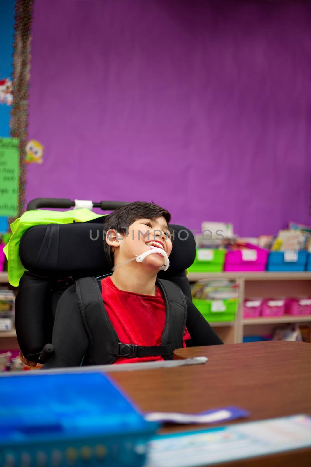 Disabled boy in first grade classroom by jarenwicklund