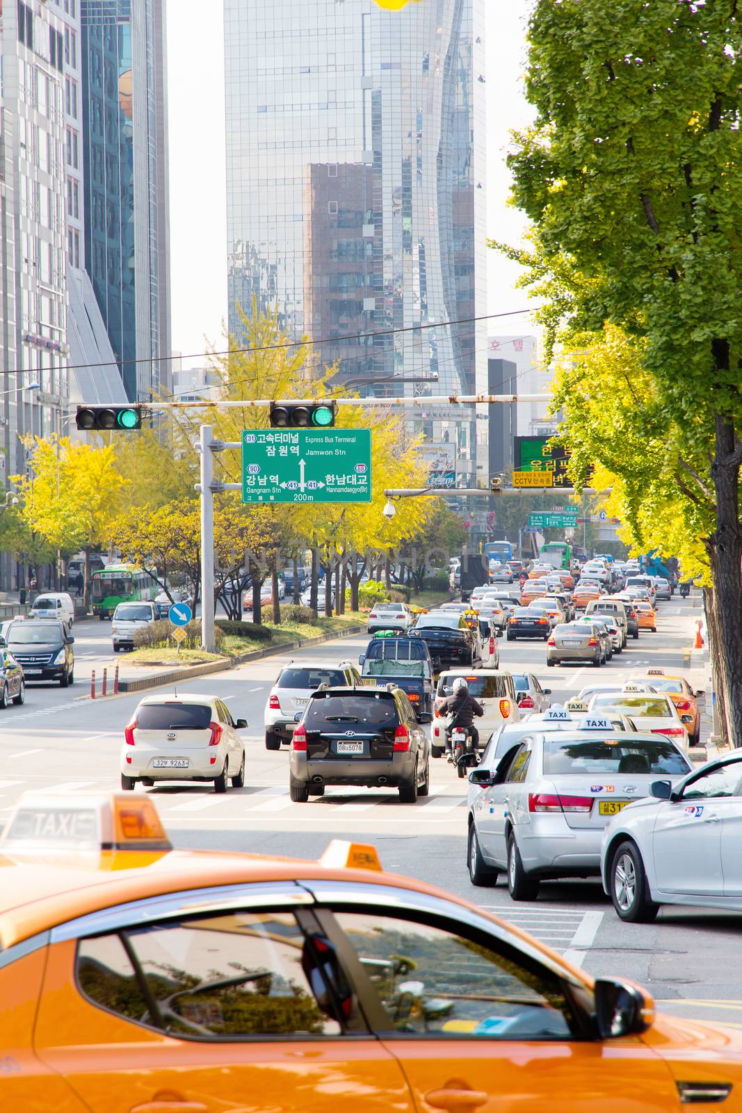 Seoul, Republic of Korea - November 4, 2014: Traffic approaching on a busy road through the Gangnam district on November 4, 2014 in seoul, Gangnam is an affluent district in Seoul, South Korea.