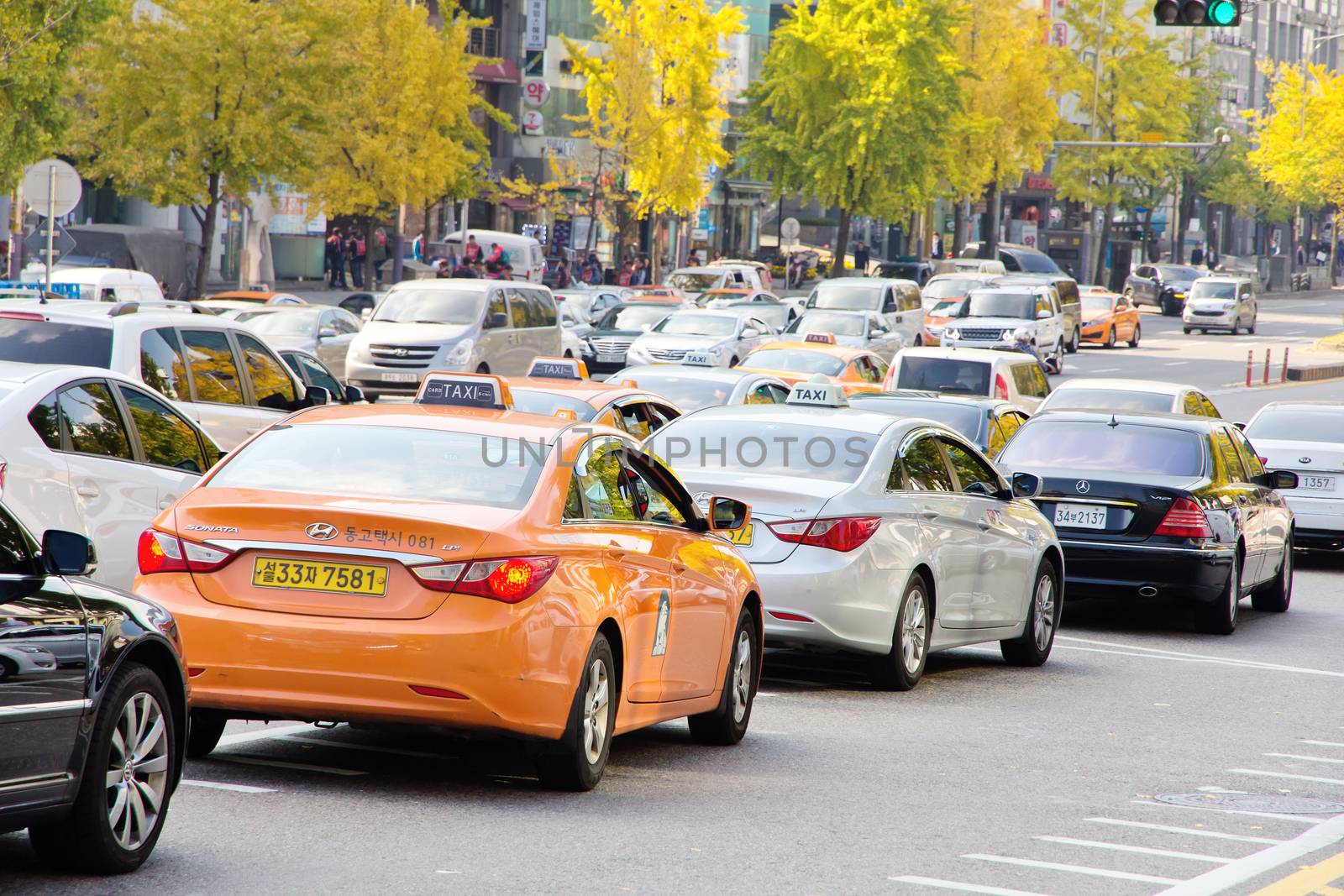 Seoul, Republic of Korea - November 4, 2014: Traffic approaching on a busy road through the Gangnam district on November 4, 2014 in seoul, Gangnam is an affluent district in Seoul, South Korea.