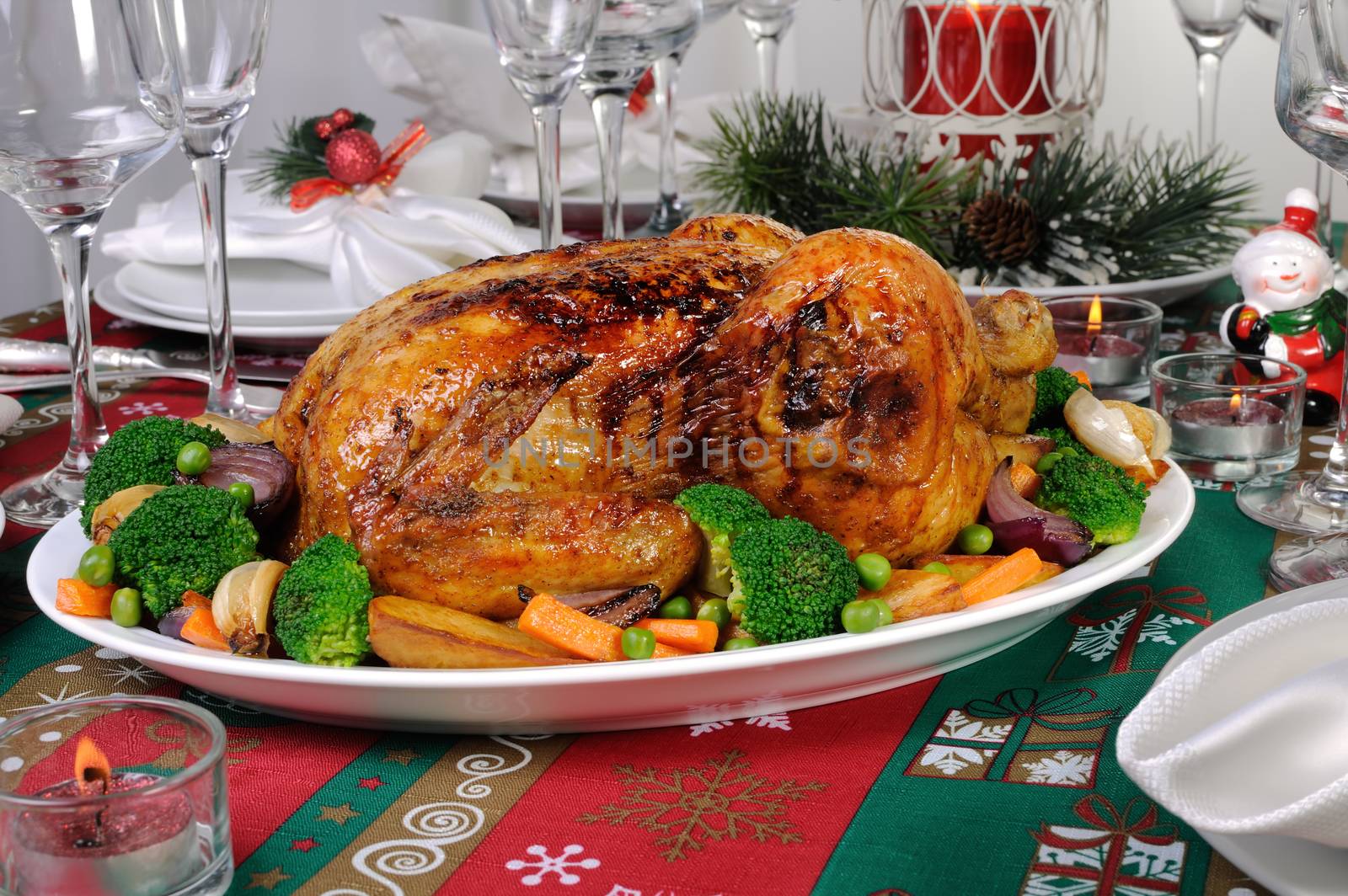 Baked chicken with vegetables on the festive table