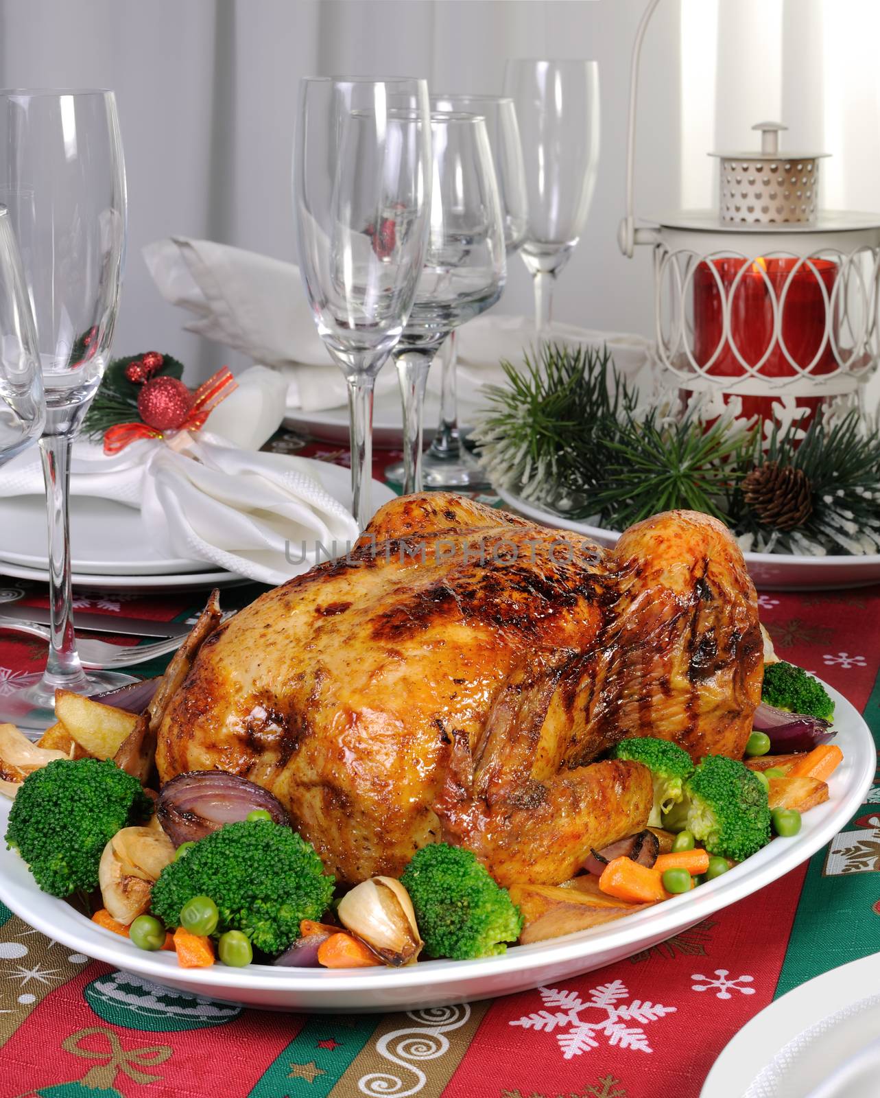 Baked chicken with vegetables on the festive table