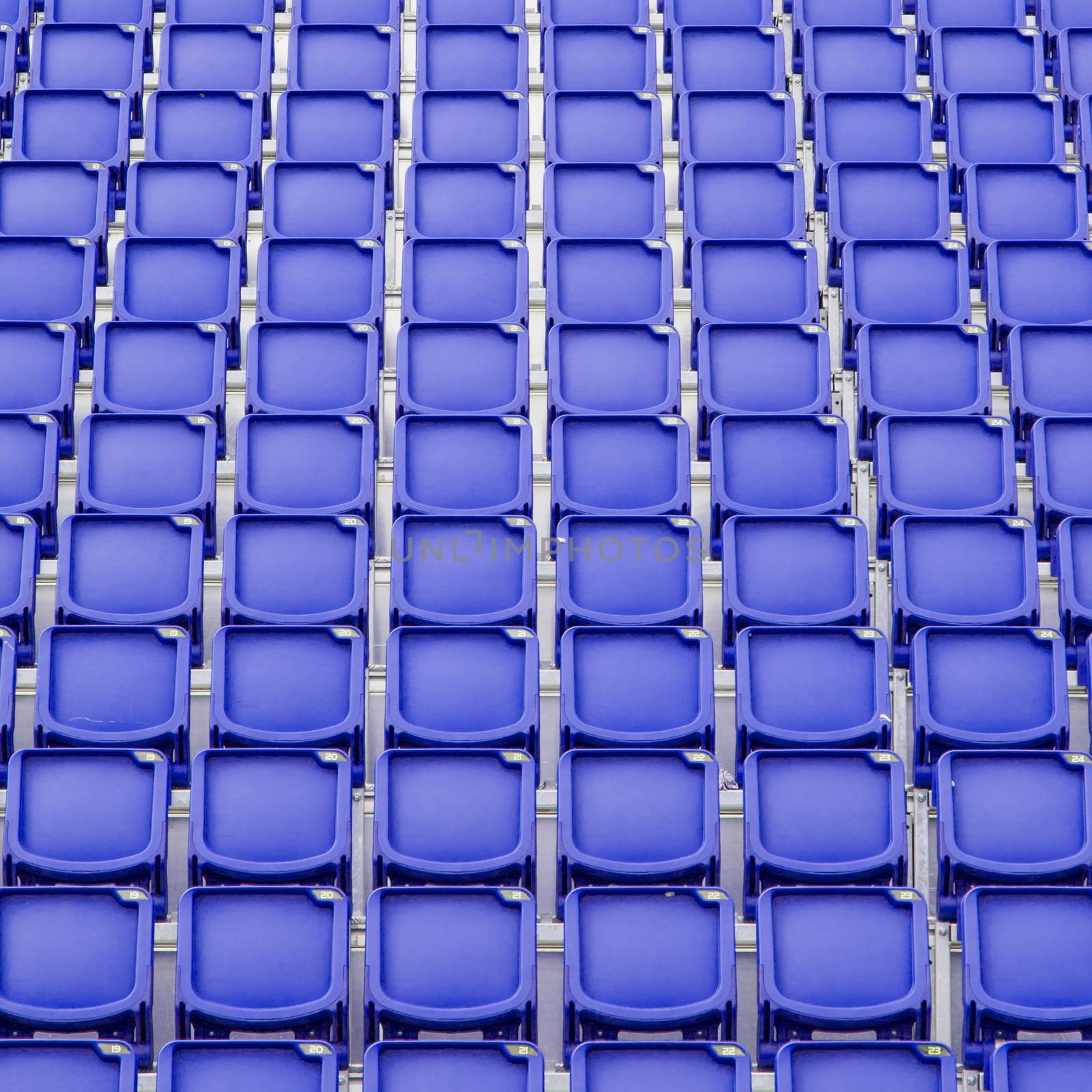 Blue seat in sport stadium, empty seats ready for the public