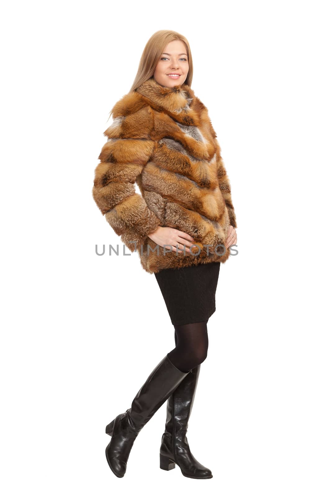 The blue-eyed blonde in a magnificent fur coat, it is isolated on a white background