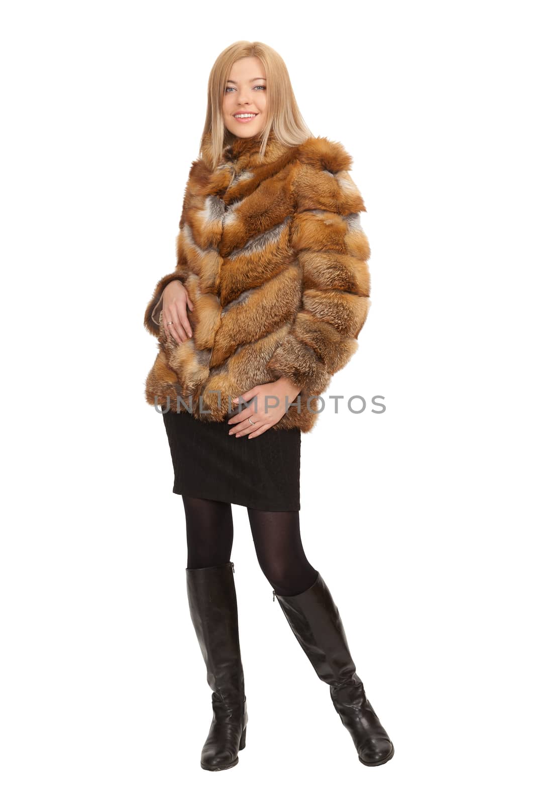 The blue-eyed blonde in a magnificent fur coat, it is isolated on a white background