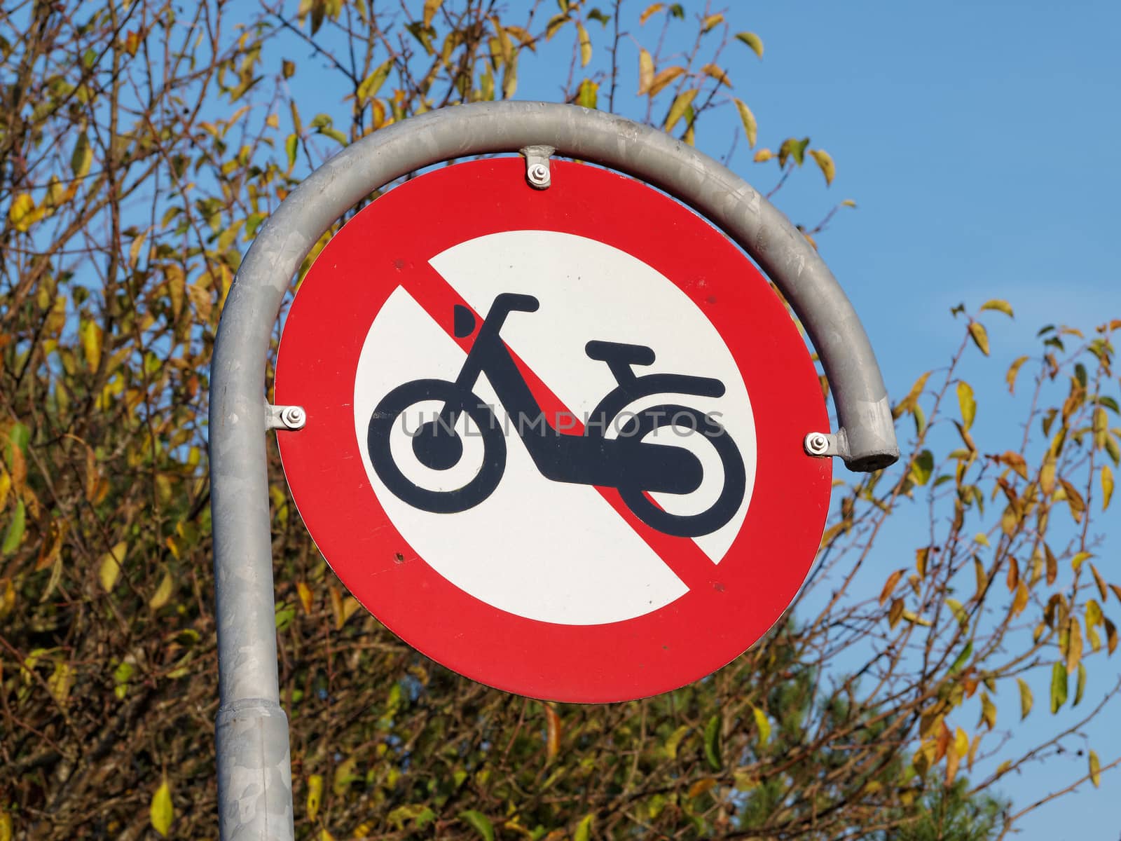 Prohibitory traffic sign the passage of  motorcycles scooters prohibited    