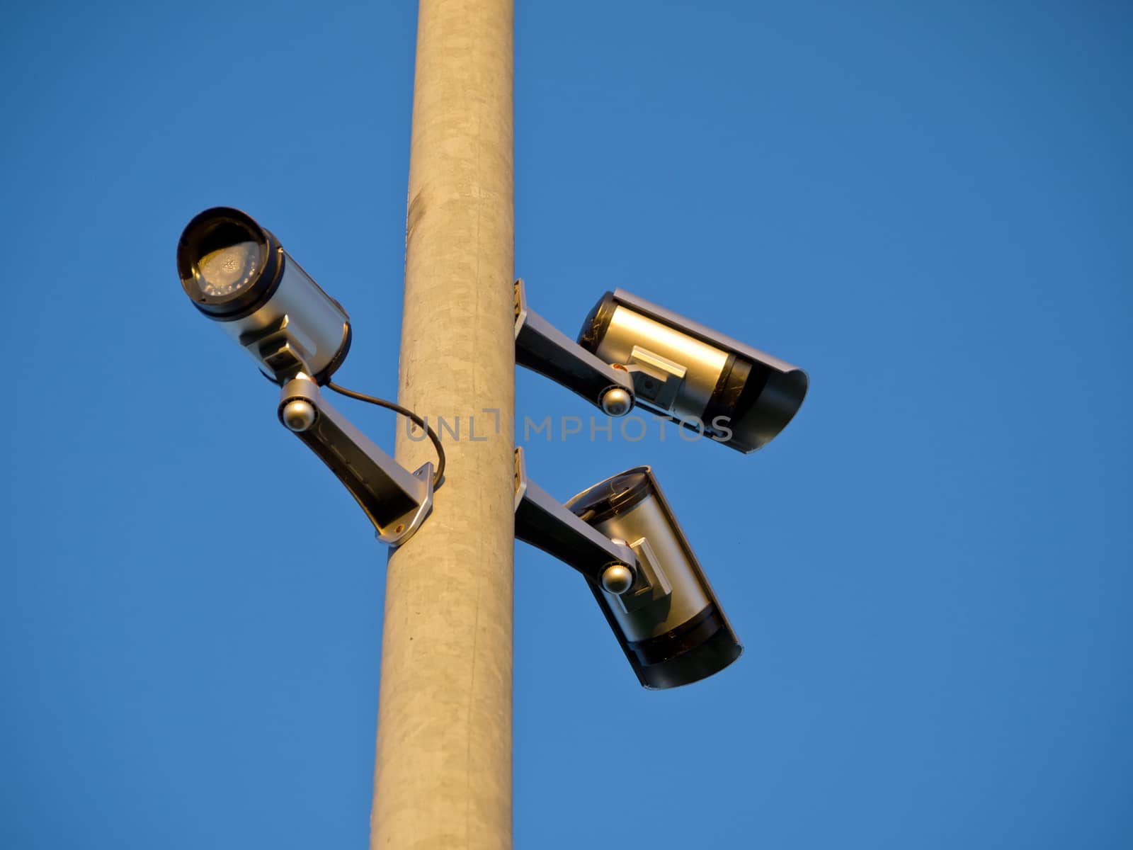 Security surveillance camera on a metal pole Big Brother