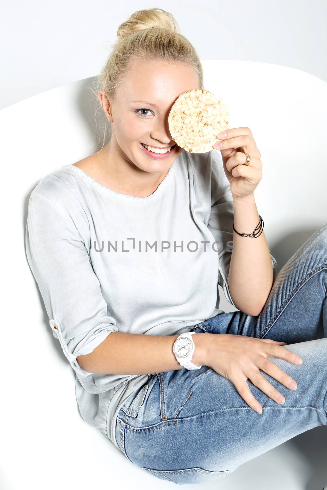 Young girl holds in hands bread rice
