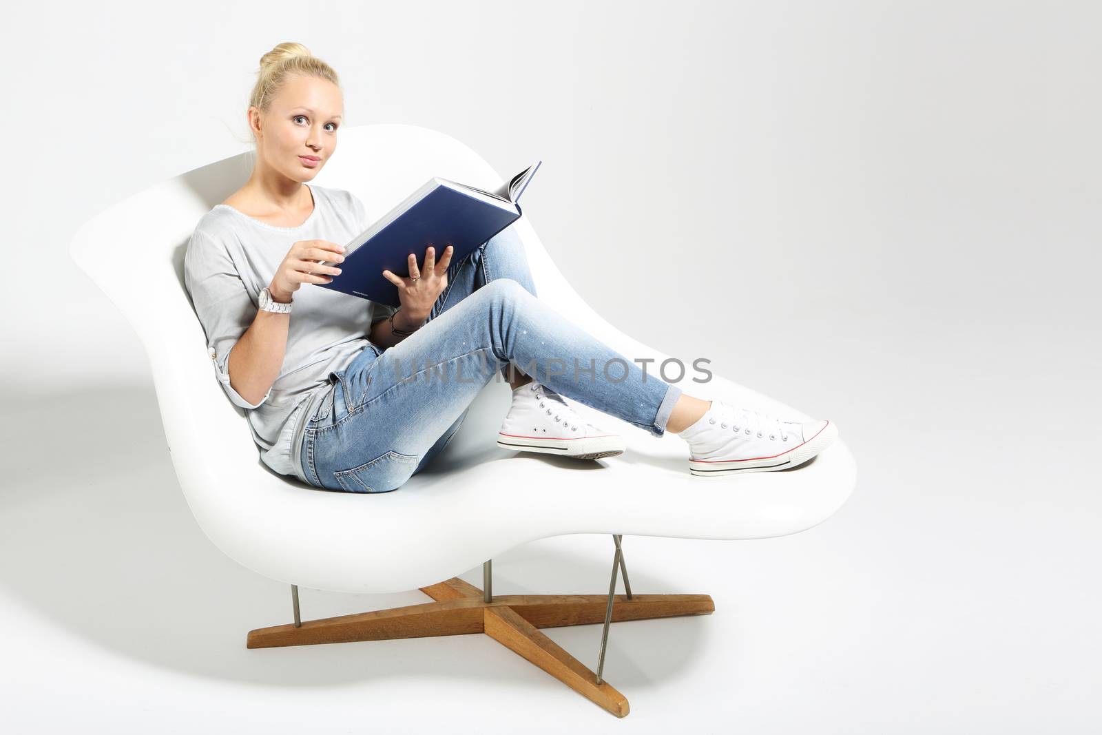 Woman reading a book. by robert_przybysz