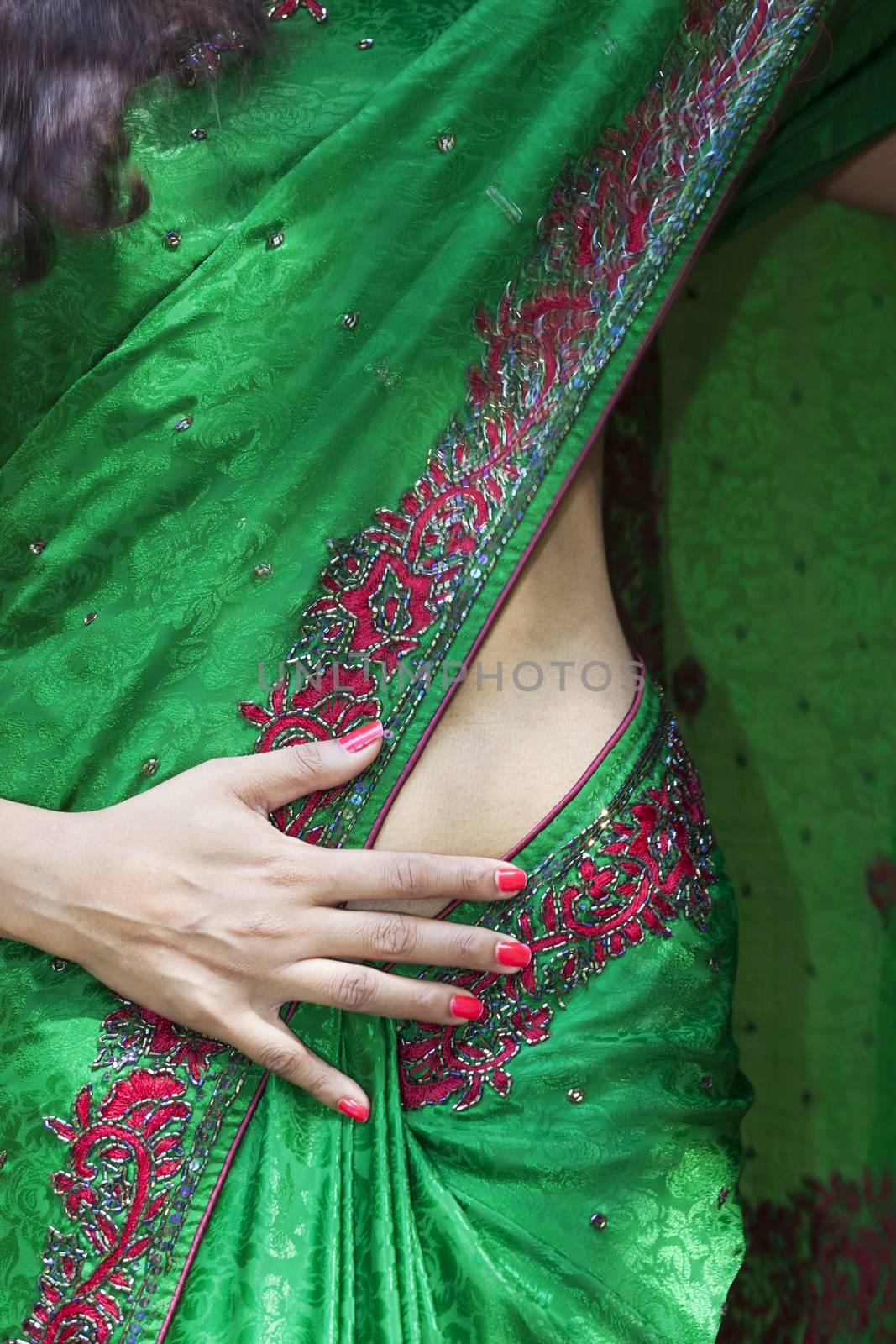 young indian woman in a saree outdoors