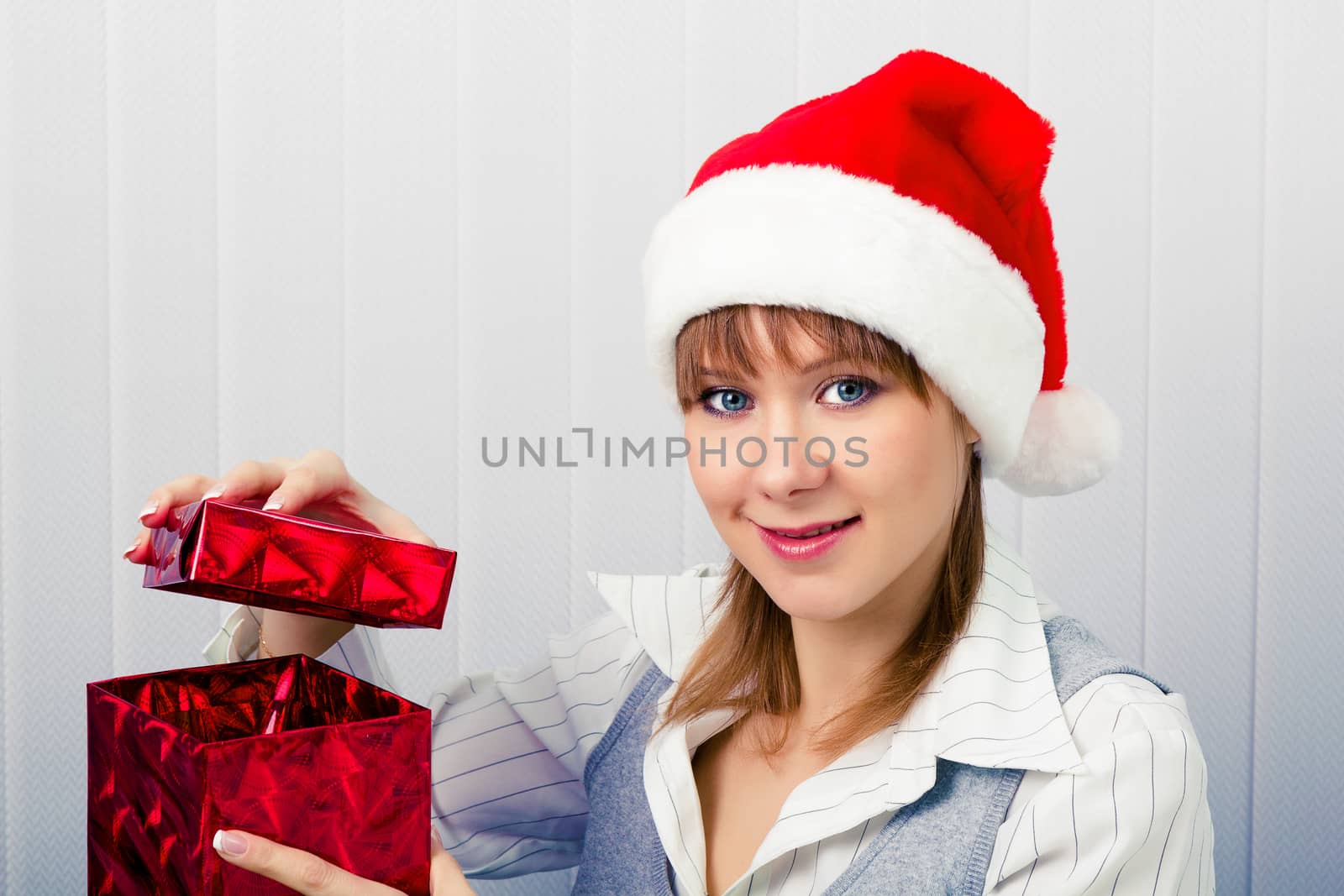 girl in the office in Santa hats with a gift by pzRomashka