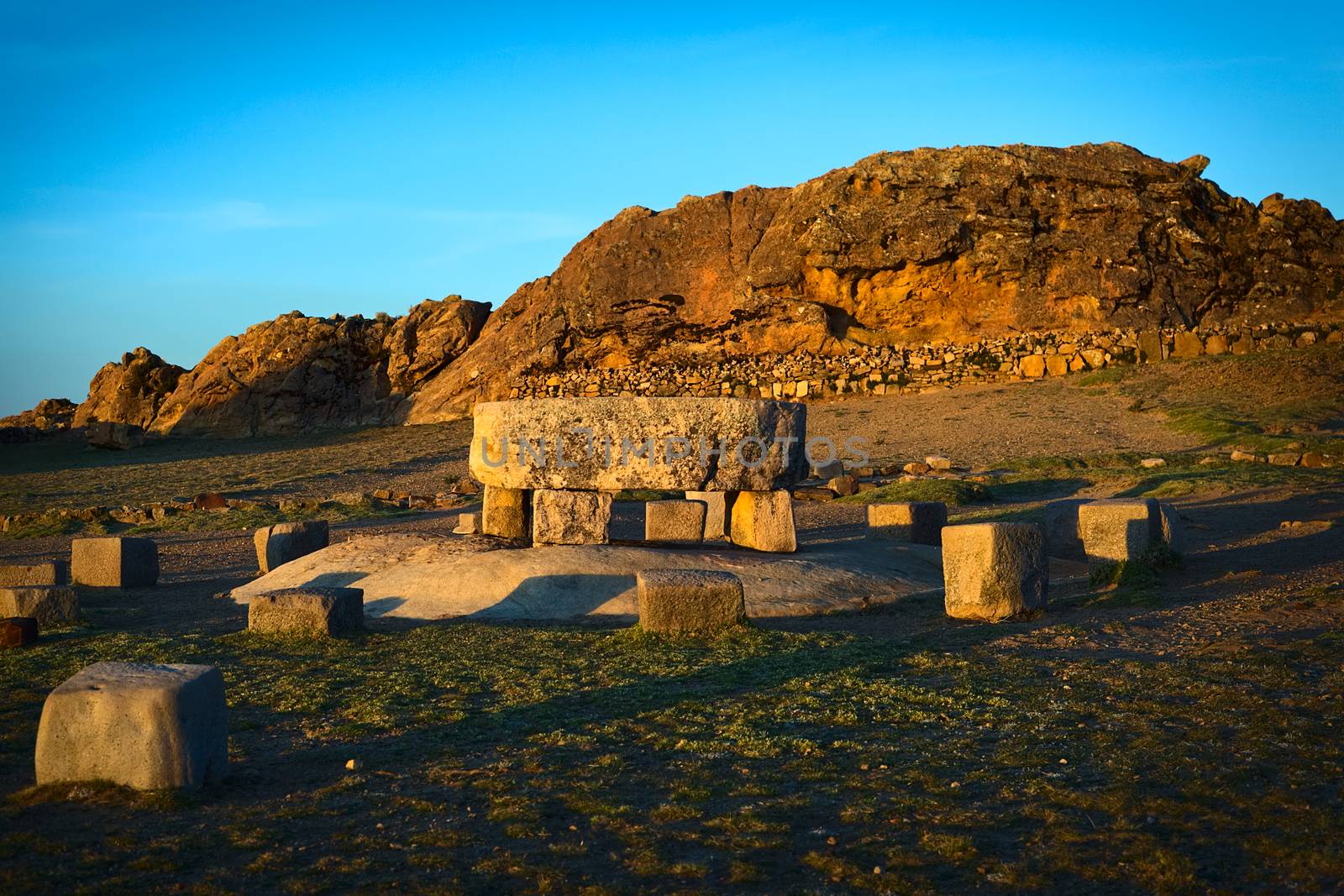 The Ceremonial Table and behind it the Rock of the Puma (Titicaca) popular archeological sites of Tiwanaku and Inca origin on Isla del Sol (Island of the Sun) in Lake Titicaca, Bolivia photographed at sunset