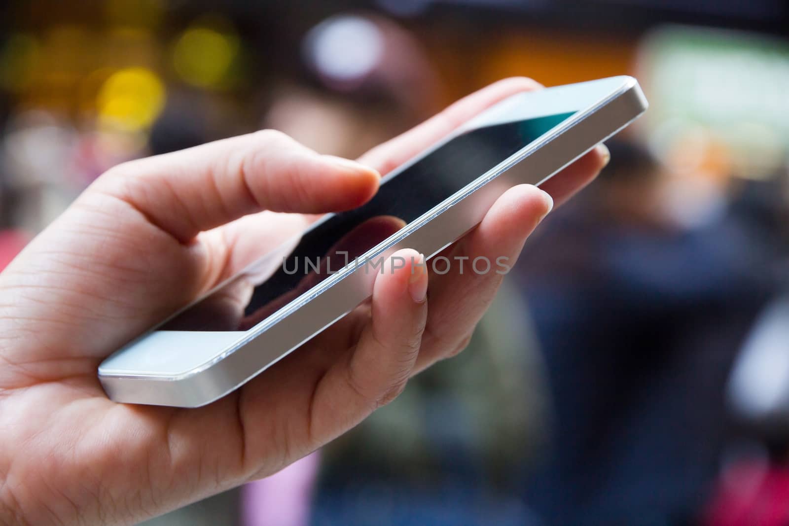 Teenage girl text messaging on her phone