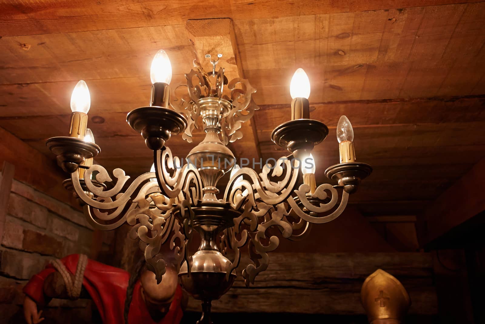 Vintage classical brass copper chandelier in a rustic country style house                               