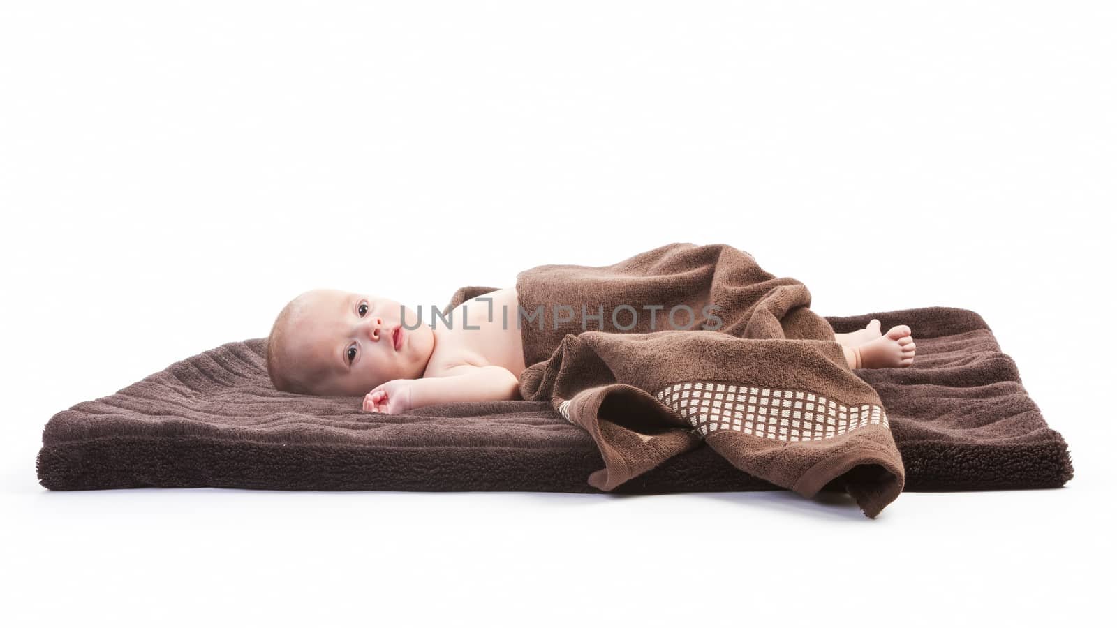 baby boy over brown blanket on white background