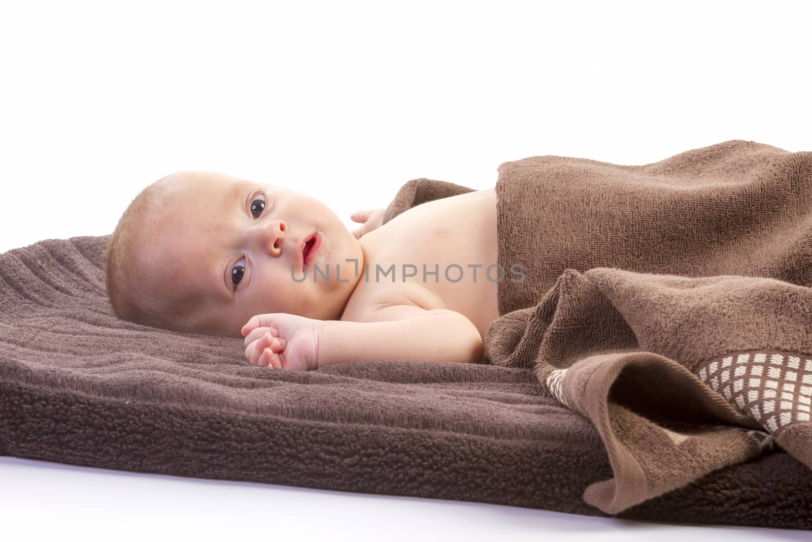 baby boy over brown blanket on white background