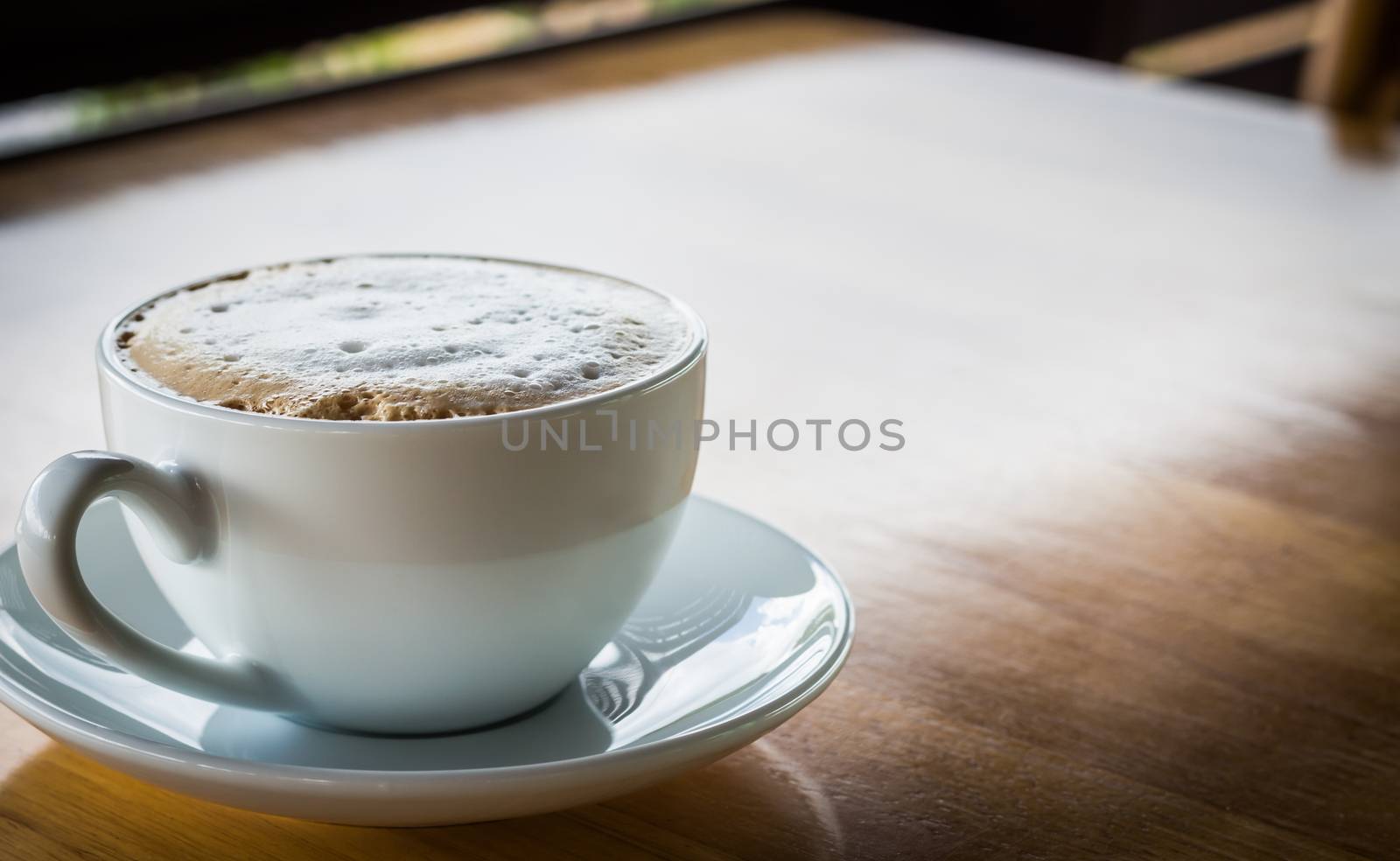 coffee cup on table by blackzheep