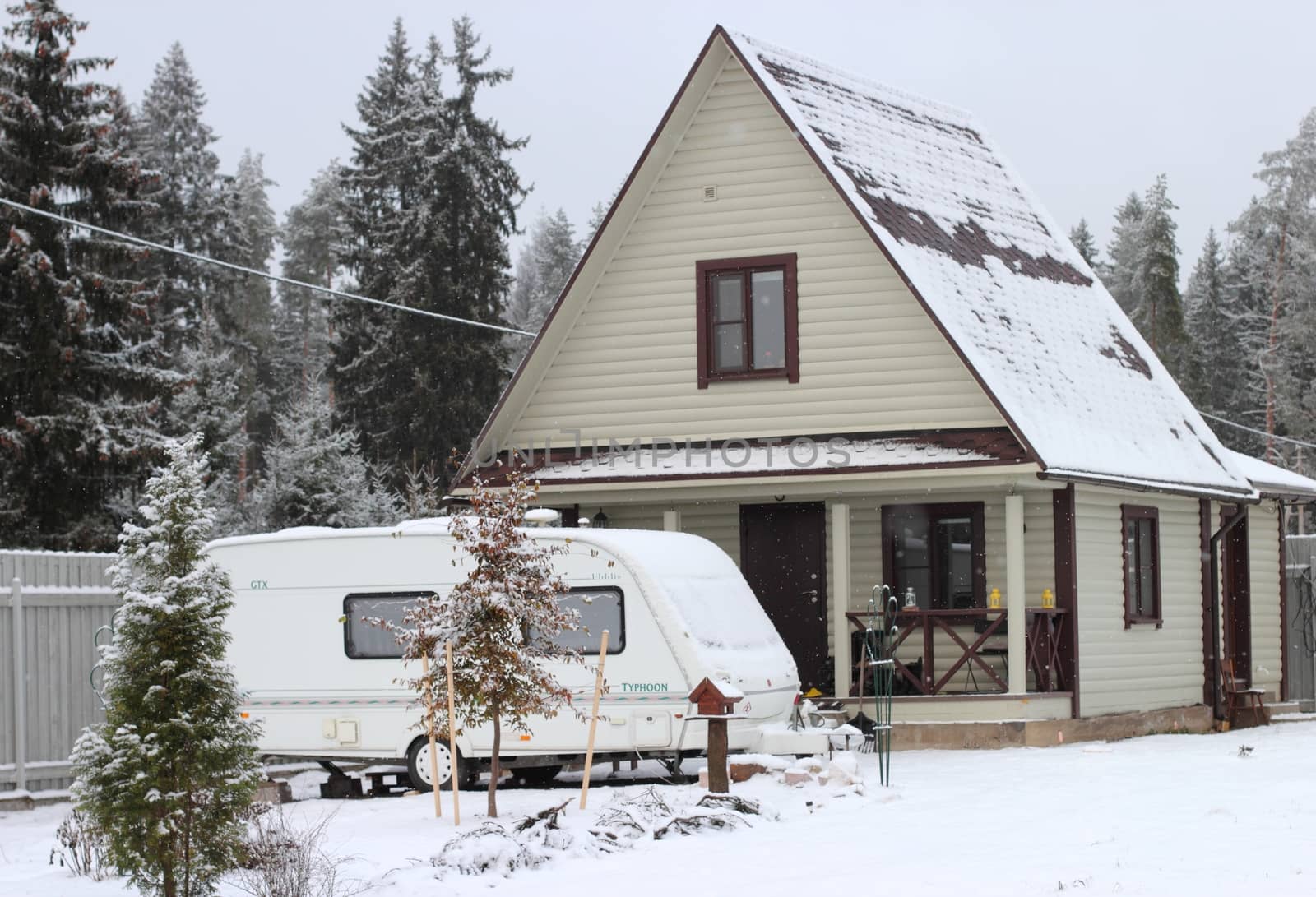 Wooden  Painted House and camping in the winter. bright colors