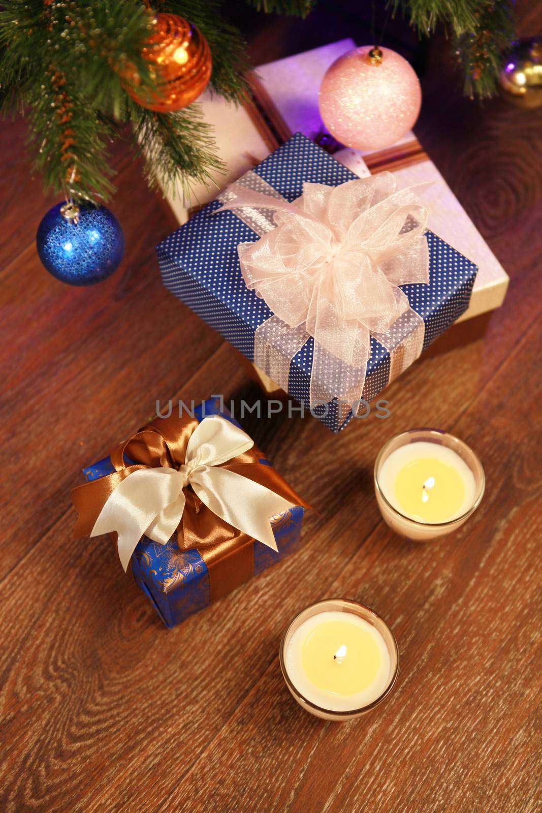 Christmas gift boxes in the interior with two candle