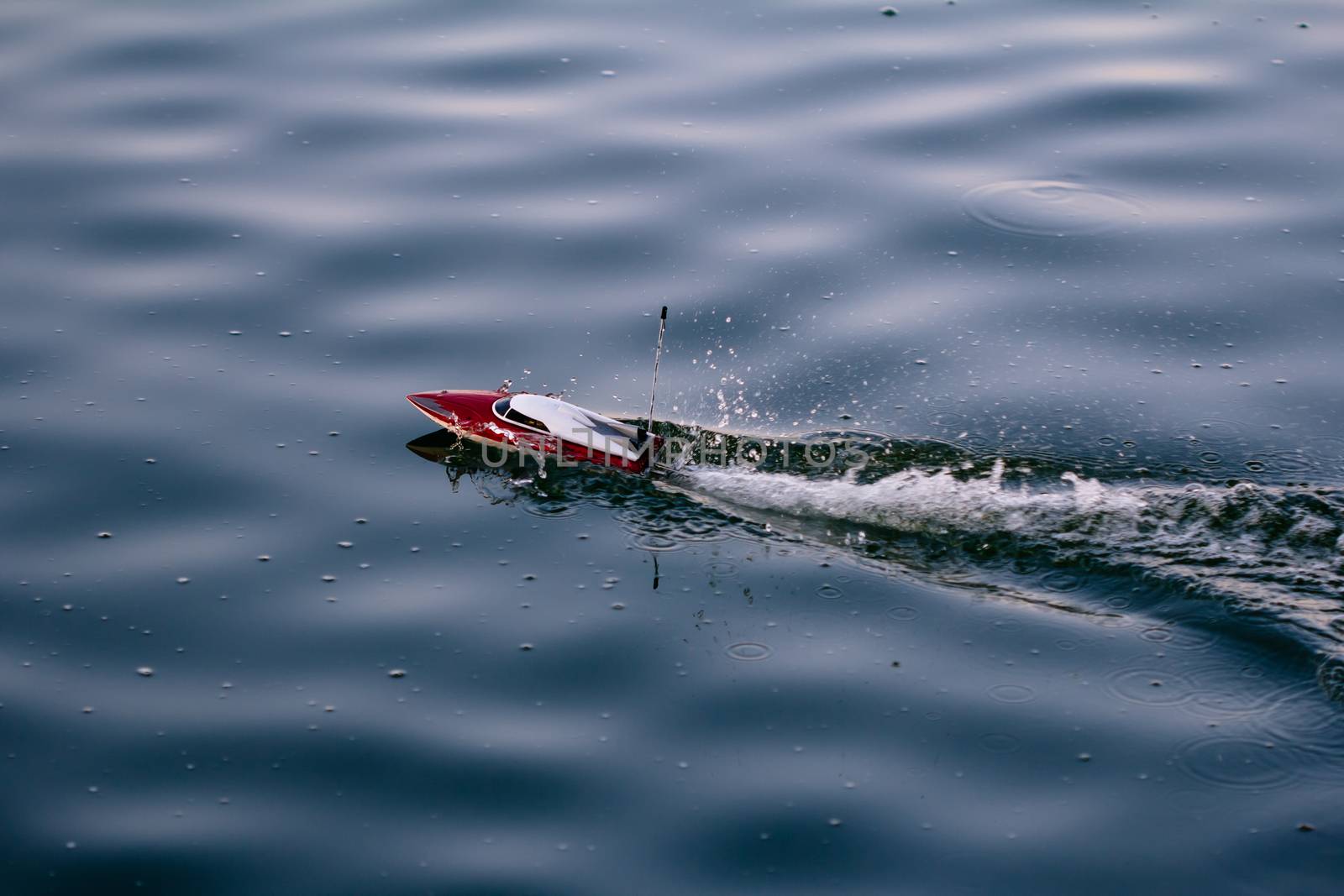 Remote control boat in the blue lake
