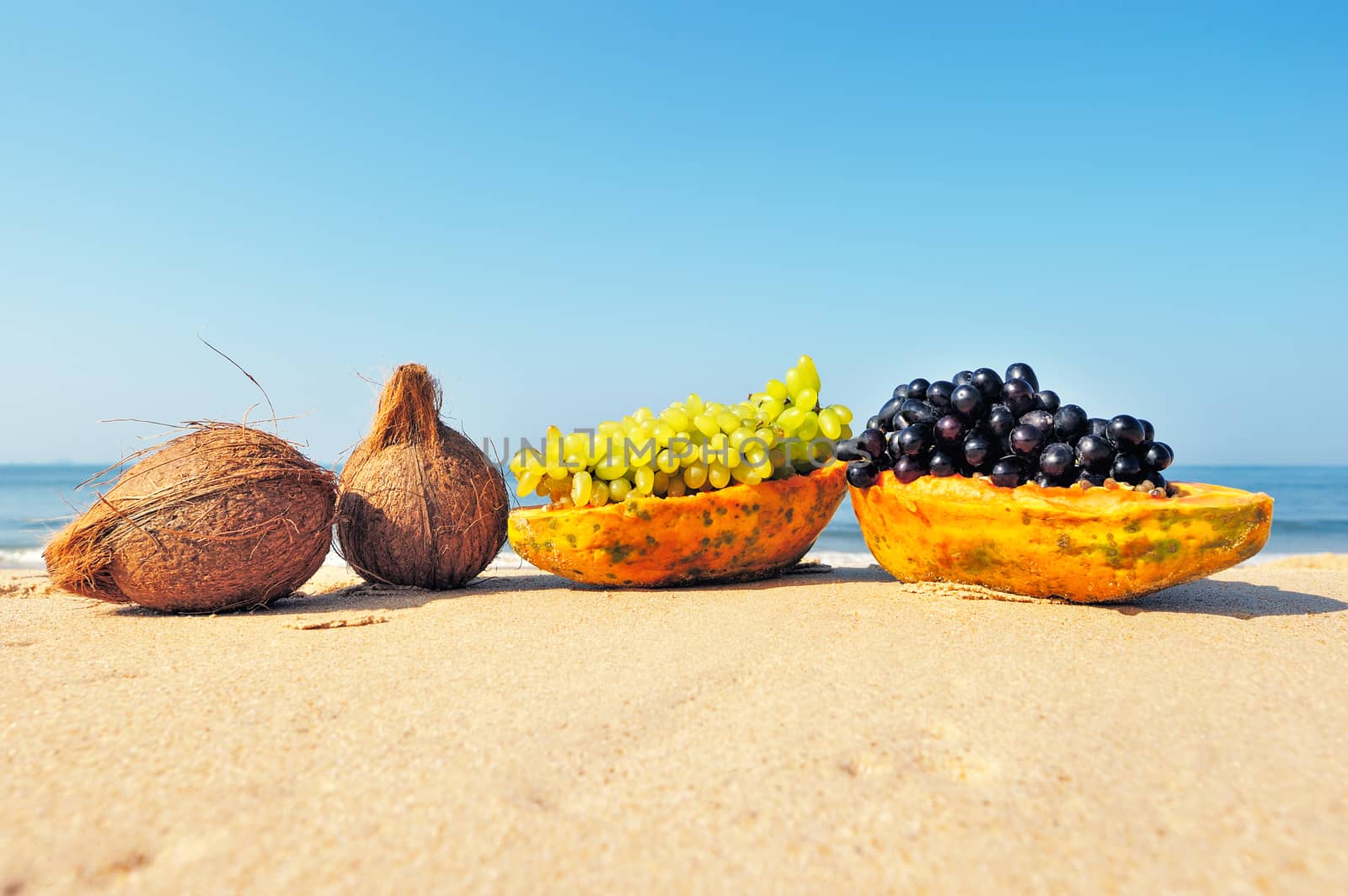 Exotic tropical fruit on the sandy beach