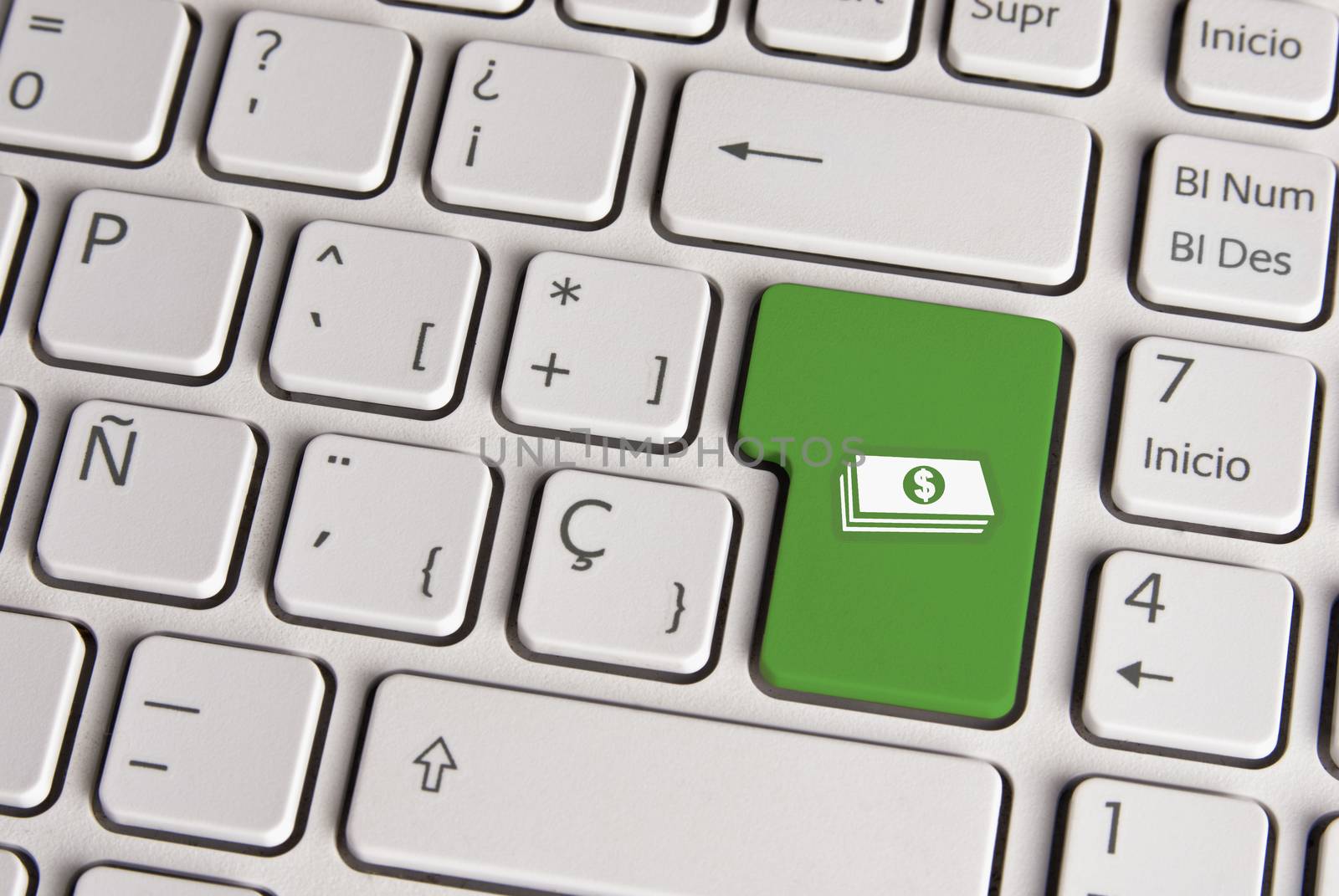 Spanish keyboard with money cash icon over green background button. Image with clipping path for easy change the key color and editing.