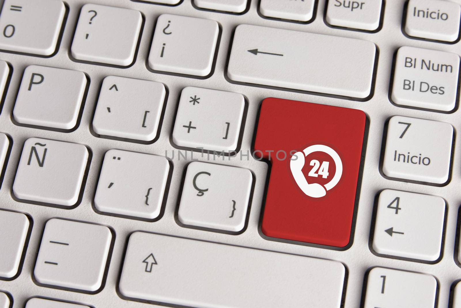 Spanish keyboard with 24 hours call support service phone icon over red background button. Image with clipping path for easy change the key color and editing.