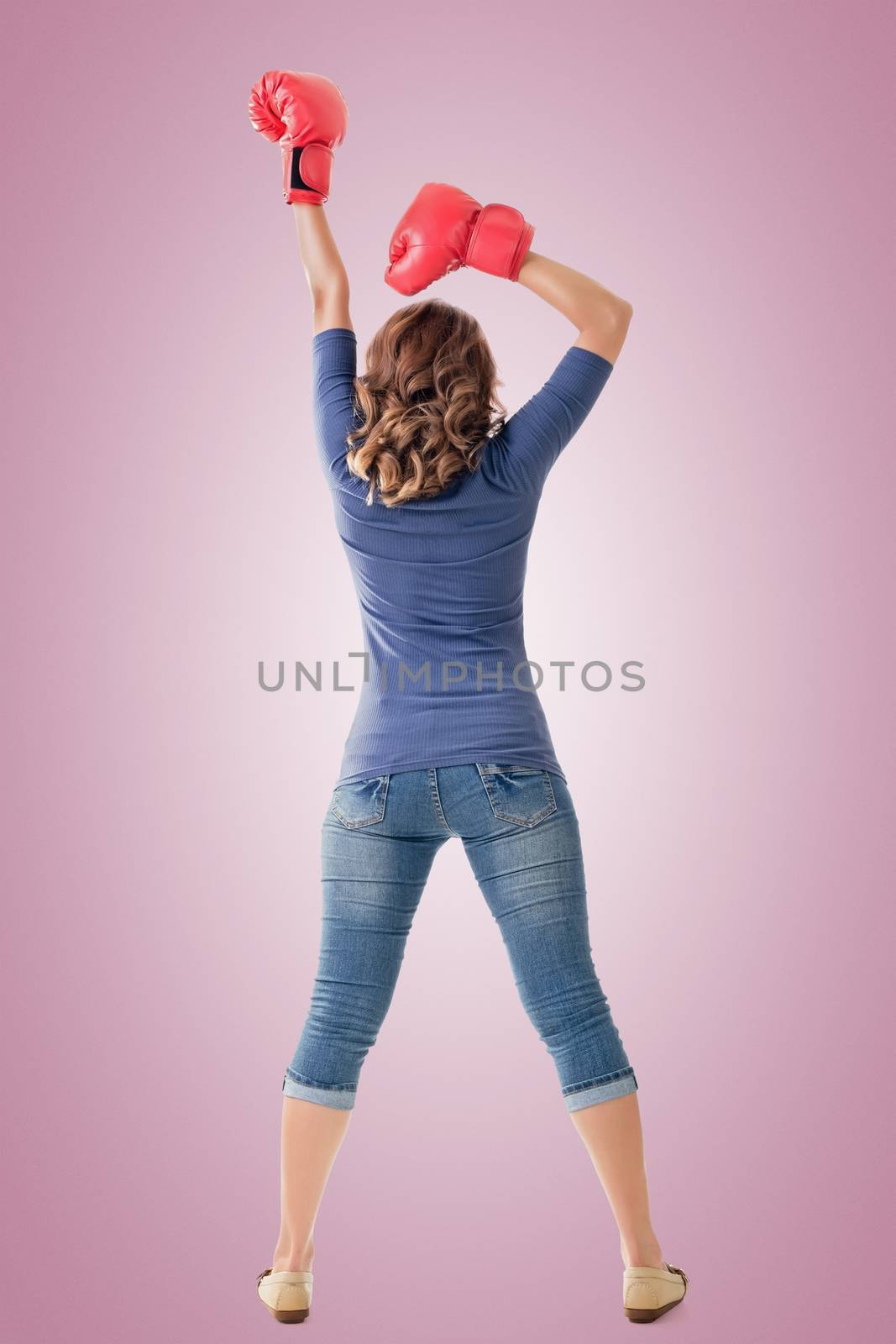 Fighting girl concept, rear view full length portrait of Asian isolated on white.