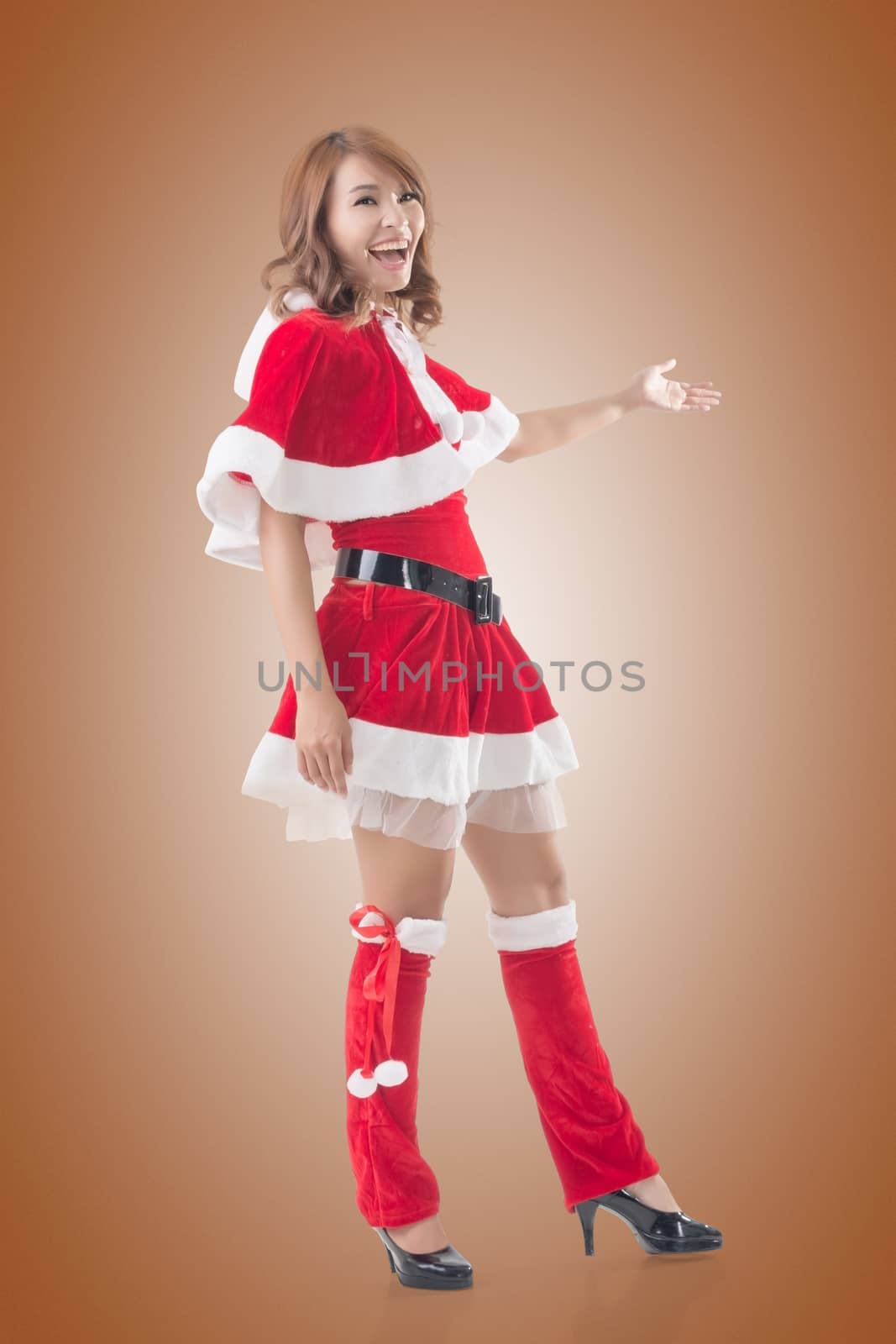 Smile happy Asian Christmas girl introduce, isolated full length portrait.