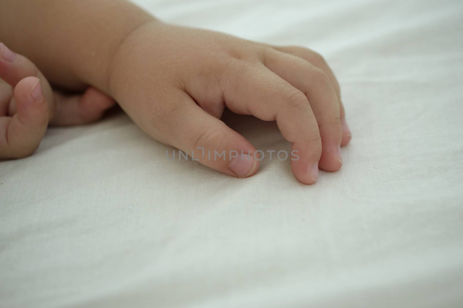 hand of a sleeping baby by ncuisinier