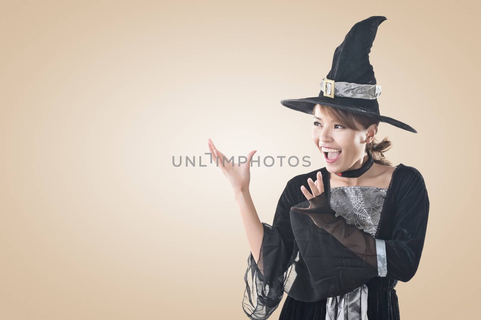 Asian witch woman using magic, closeup portrait with copyspace.